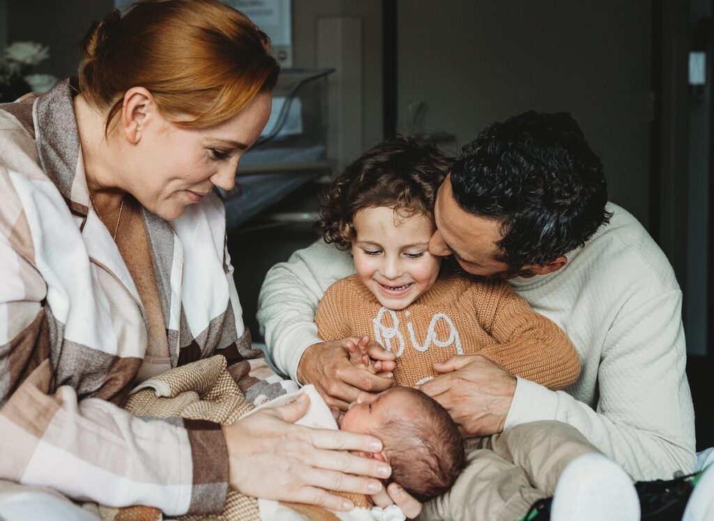 Jules and Cam with their baby and son