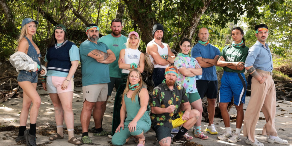 Group photo of the Brawn tribe from Australian Survivor 2025, posing on a beach in front of lush greenery.