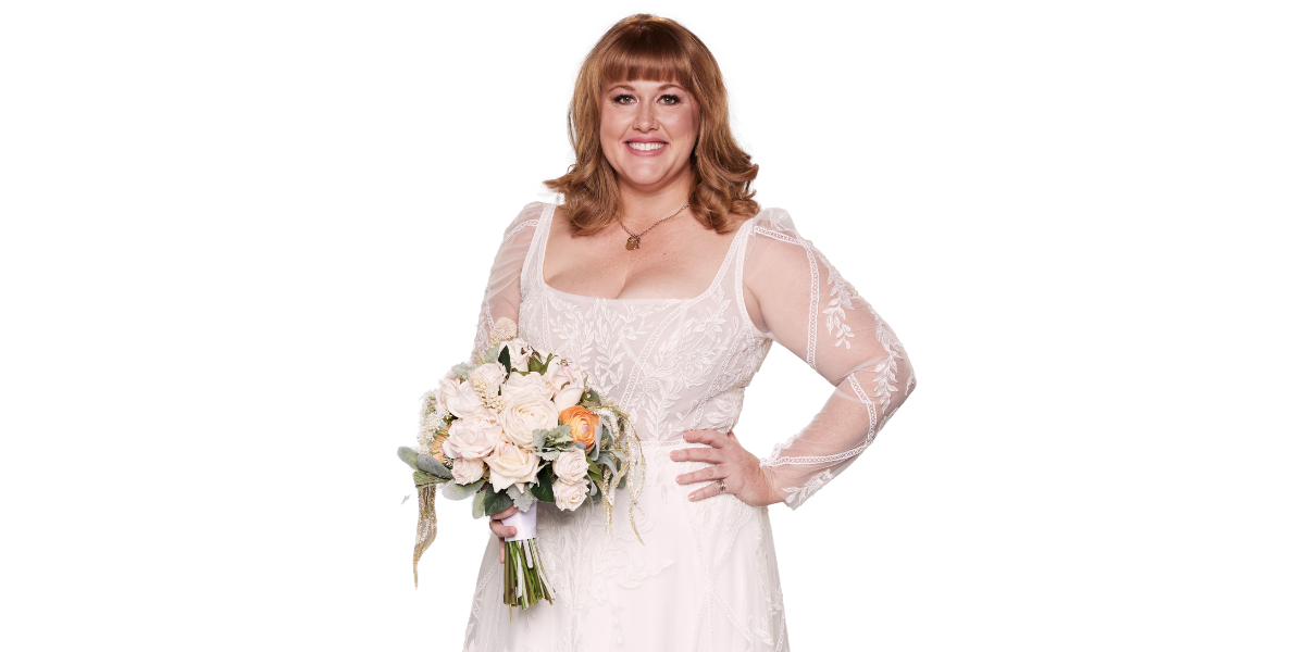 Katie Johnson from MAFS 2025, a red-haired woman in a white lace wedding dress, smiles while holding a bouquet