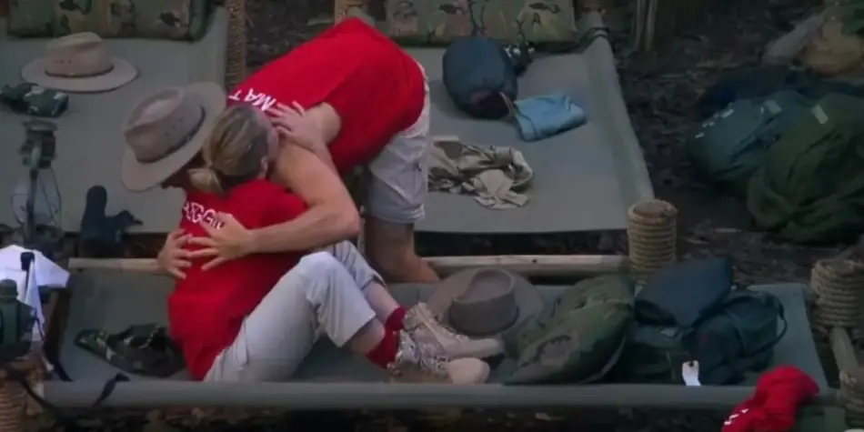 Matty J hugs Reggie Bird as they sit together at camp on I'm a Celebrity Australia 2025