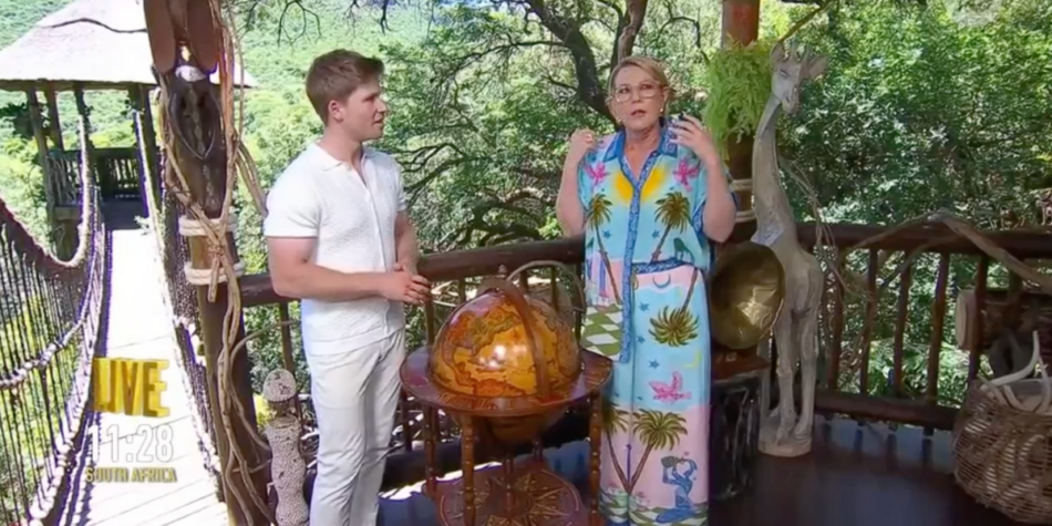 Robert Irwin and Julia Morris on the set of I'm a Celebrity 2025, standing on a wooden deck with a jungle in the background