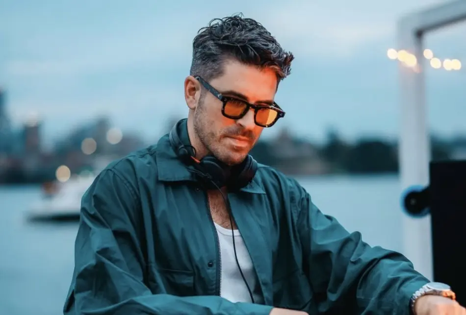 Australian Idol host Scott Tweedie DJing an event.