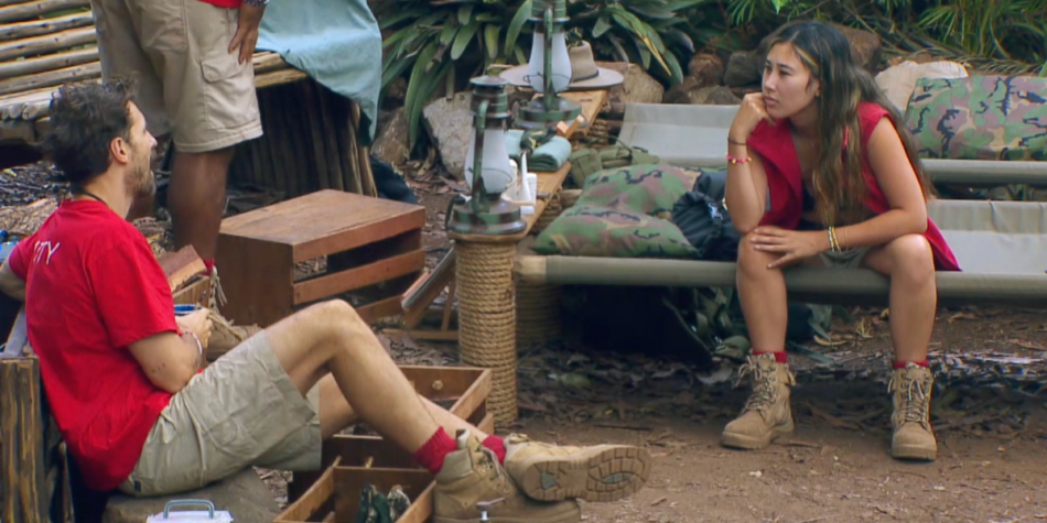 Matty J and Tina Provis in conversation at the I'm a Celebrity 2025 camp, surrounded by jungle-themed bedding and supplies