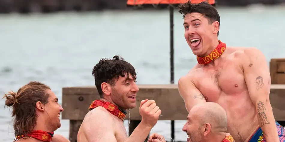 Kaelan, AJ, Kent, and Max from Australian Survivor 2025 celebrate in the water during a challenge, with Max playfully sticking out his tongue.