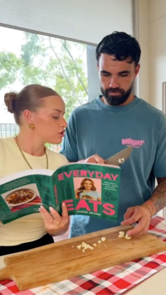 Adrian Araouzou and Jasmin Weston cooking together