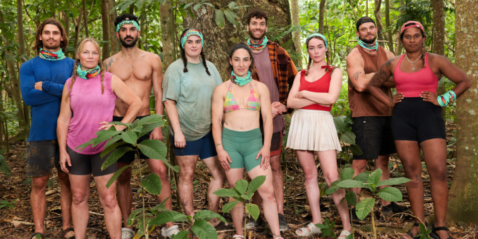 The Australian Survivor 2025 New Brawns Tribe stands together in the jungle, dressed in survival gear and buffs