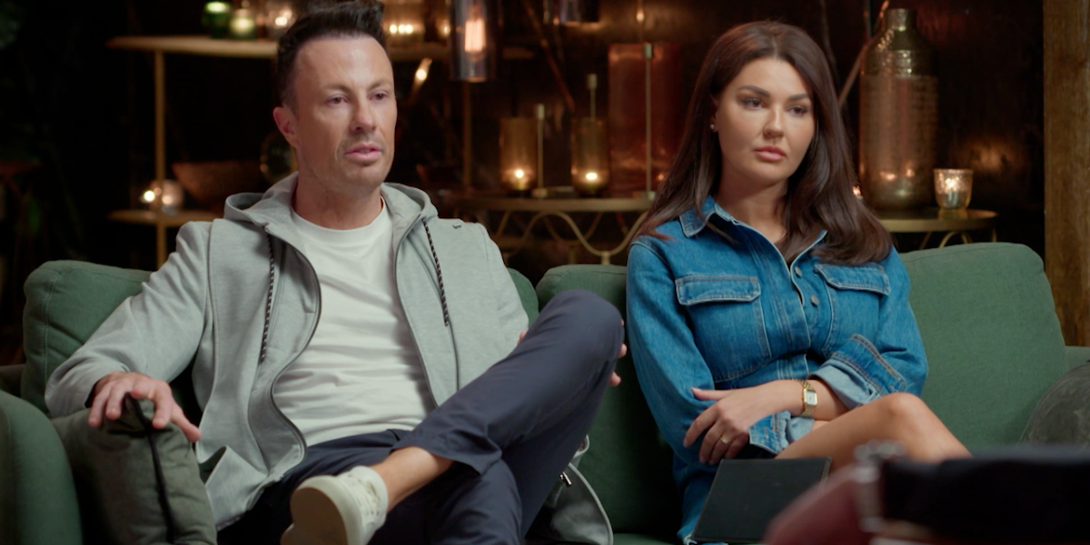 Clint and Lauren from MAFS 2025 sit on a couch, looking serious