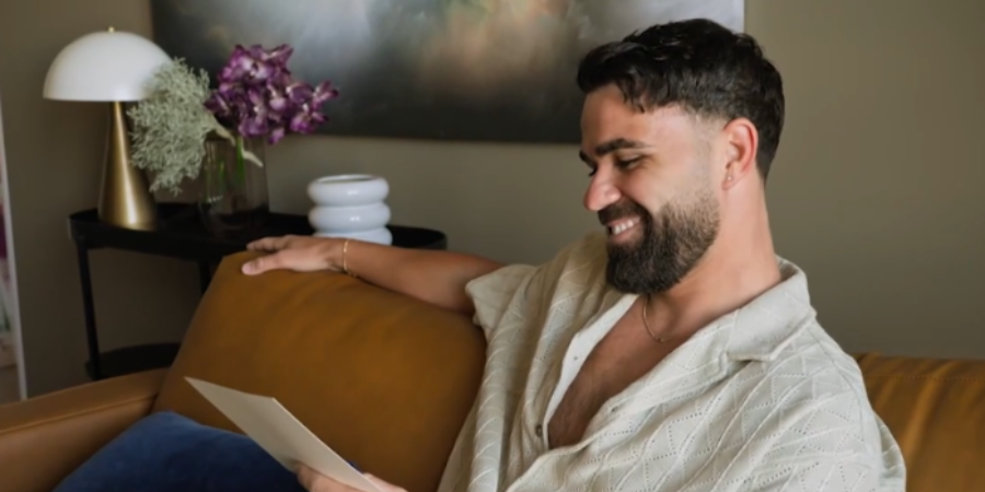 Adrian reads out the gass is greener challenge on MAFS 2025. 